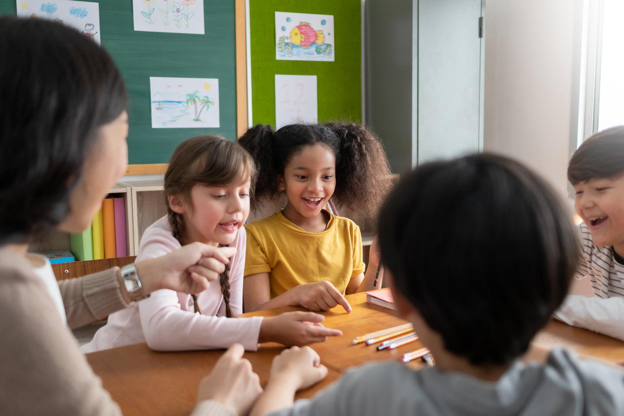 young students playing a game in the classroom