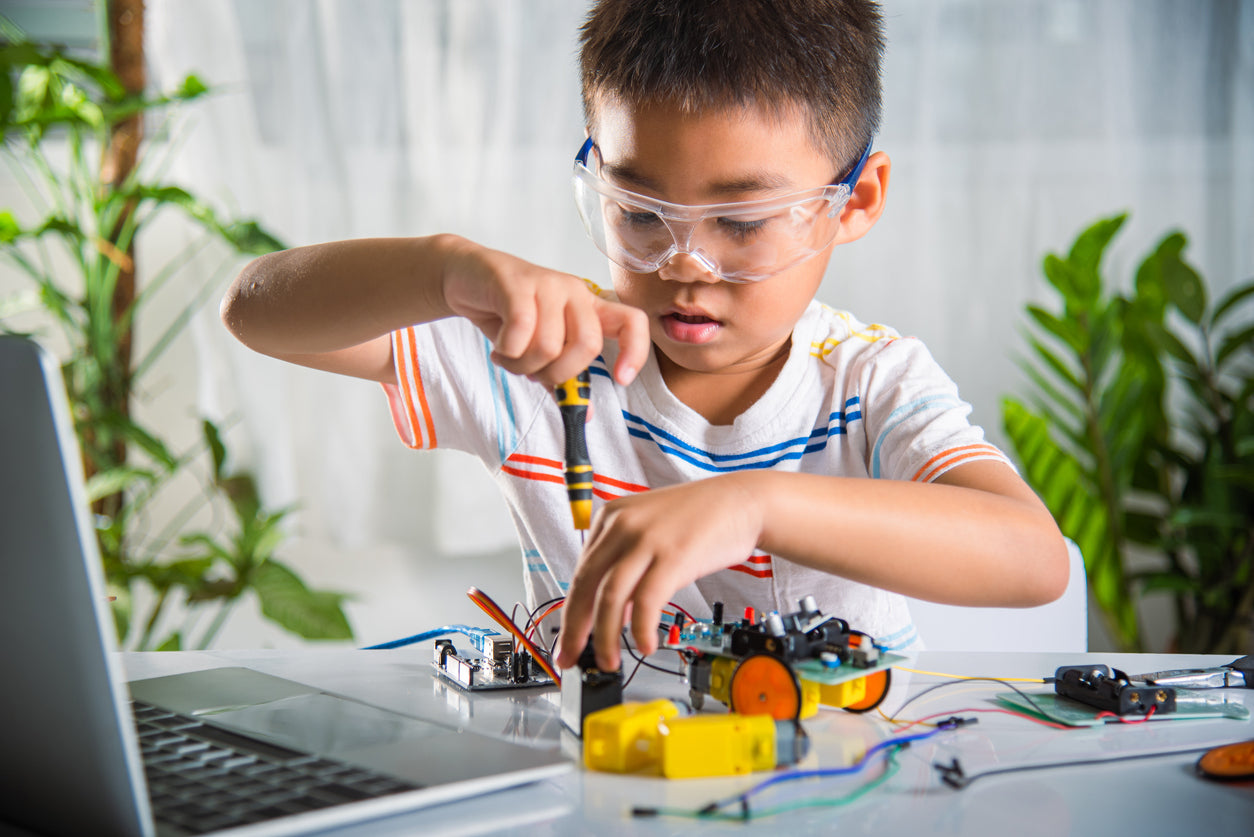 young student working on a STEM project