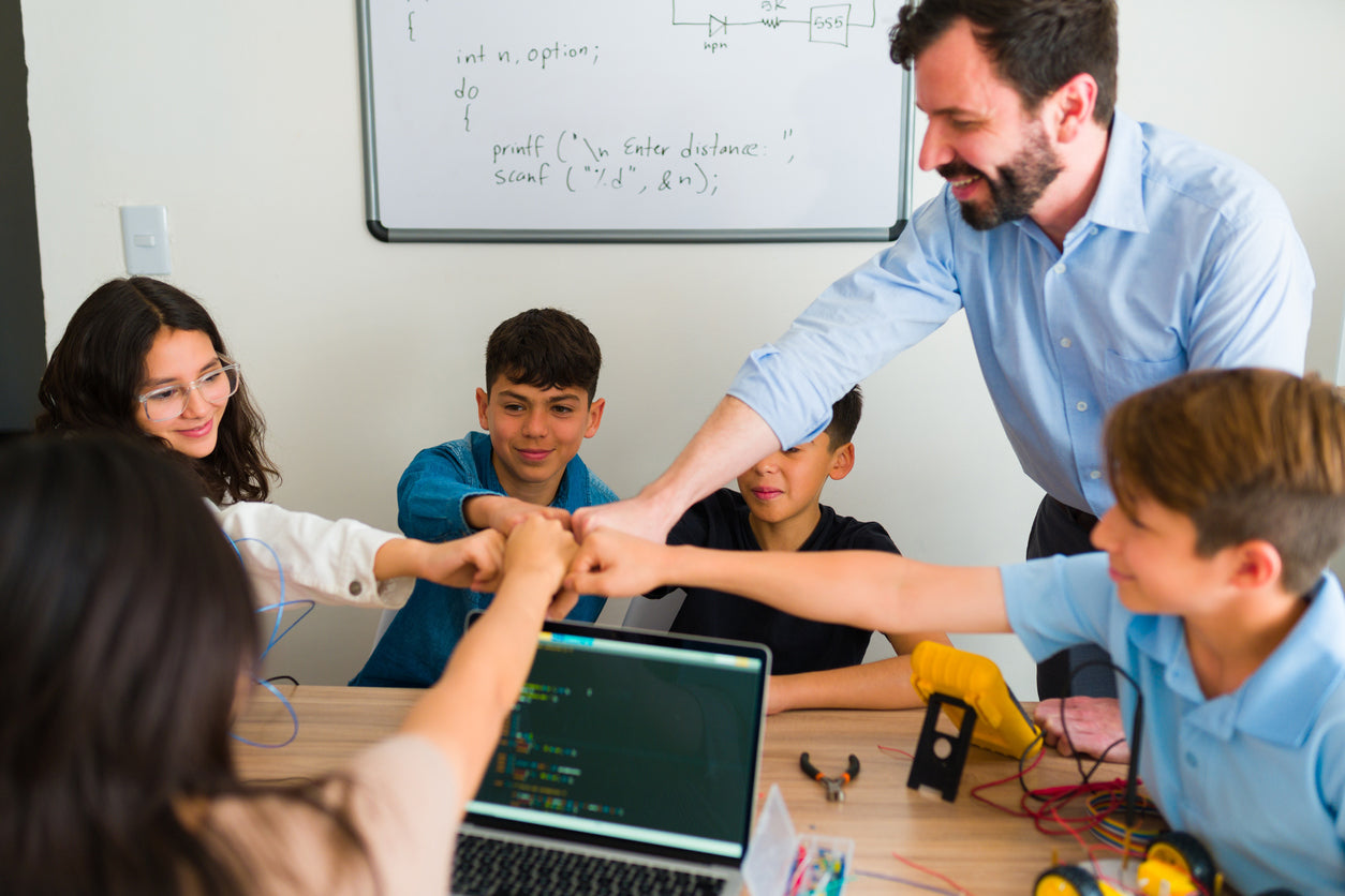 middle school students with their teacher