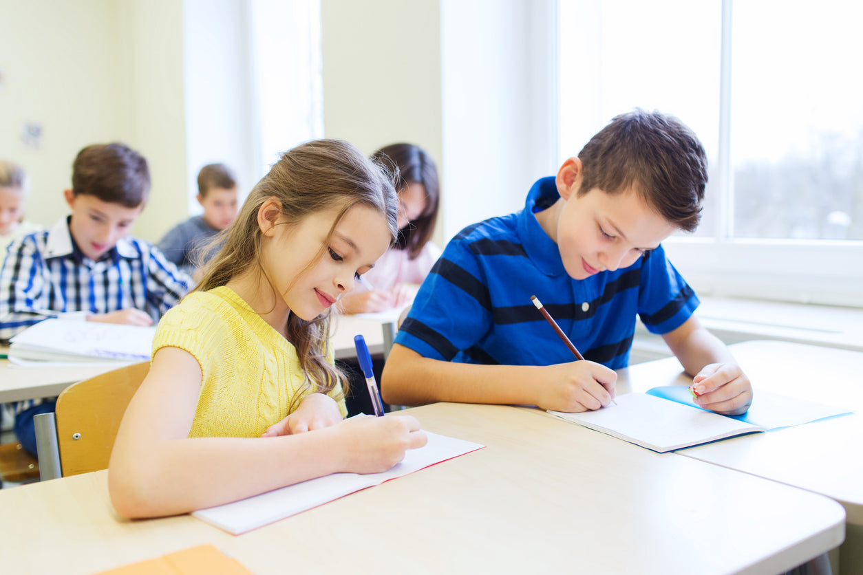 students doing a writing assignment in the classroom